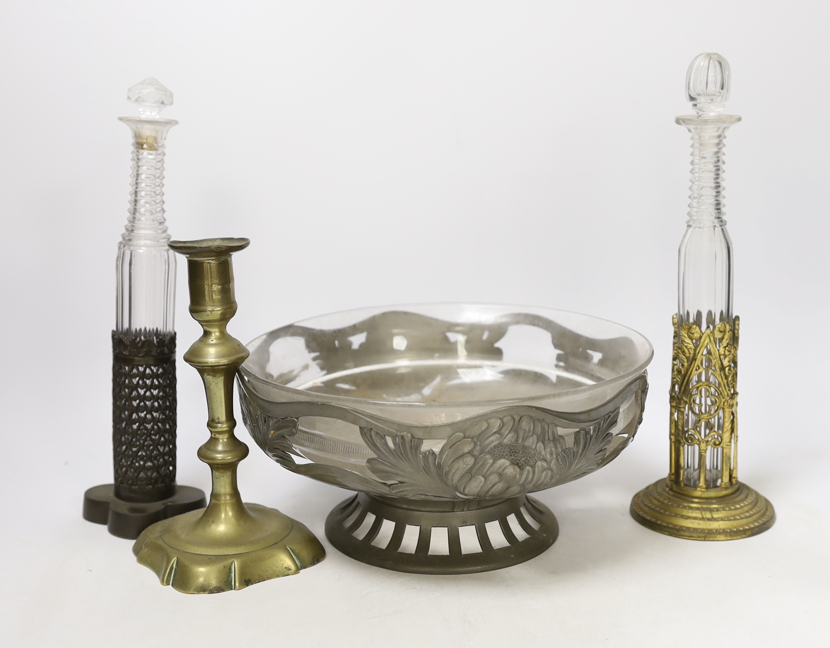 Two mid 19th century prismatic-cut scent bottles in mounts, an Orivit pewter stand and a George II brass candlestick, tallest 28cm